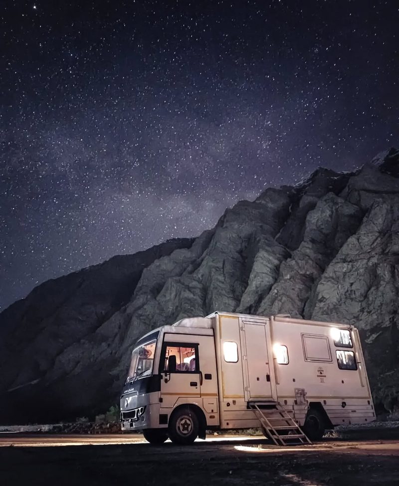 Caravan under a star-filled desert sky in Rajasthan