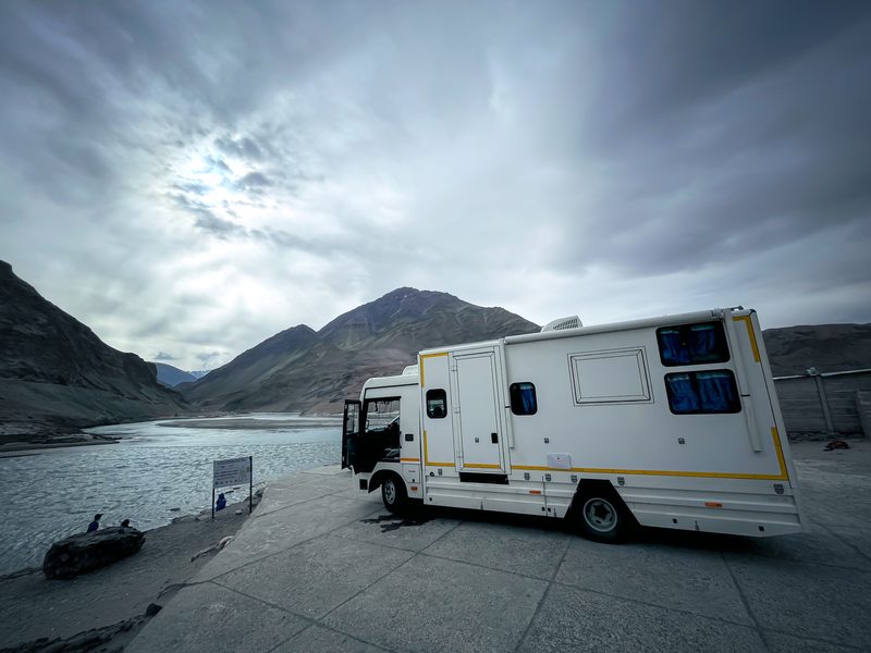 The Explorer caravan parked beside a Himalayan river