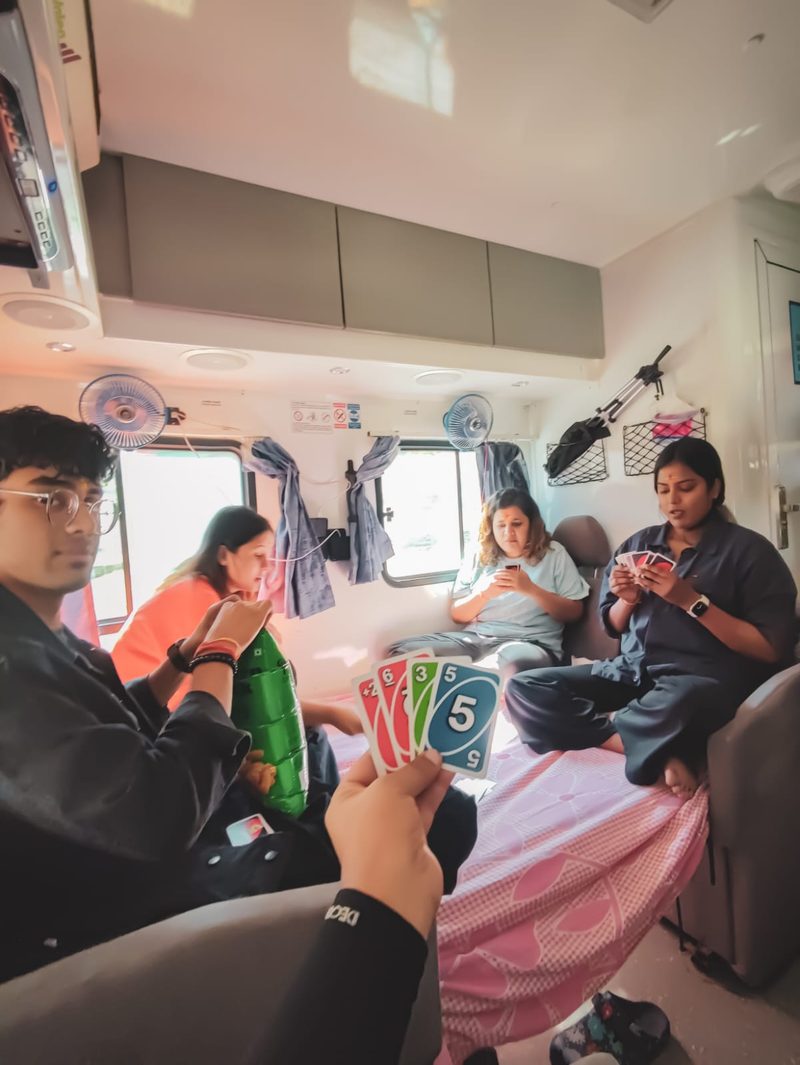 Family playing board games inside The Explorer